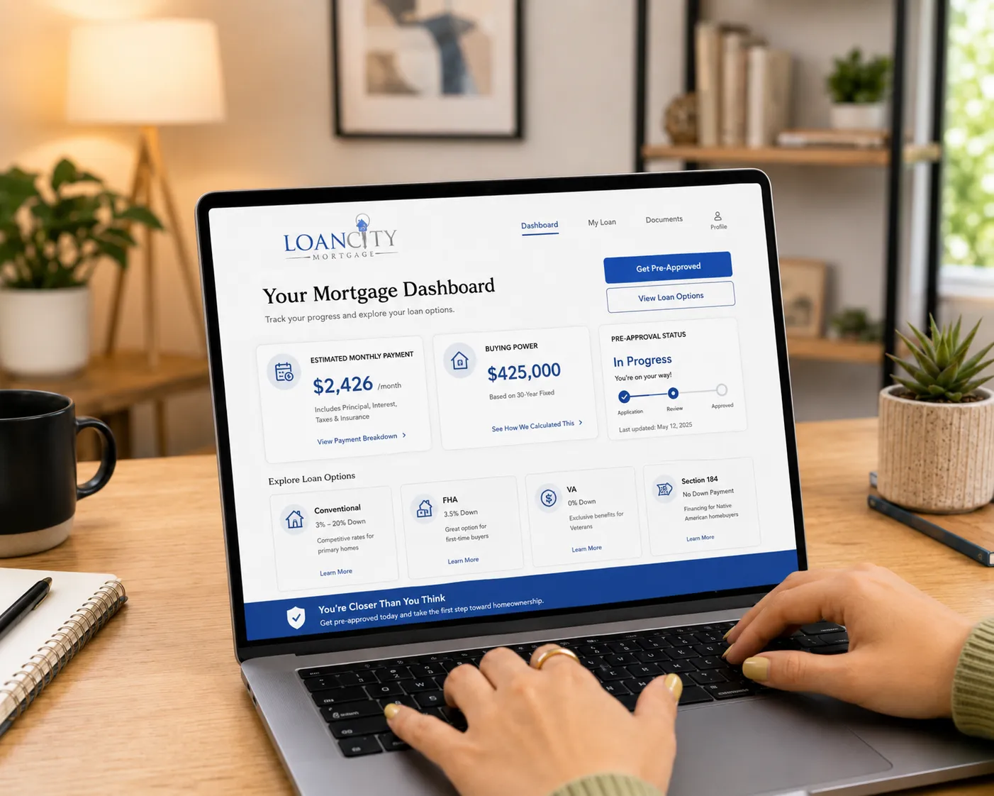 A laptop on a kitchen table showing the LoanCity mortgage dashboard, with an estimated monthly payment and buying power